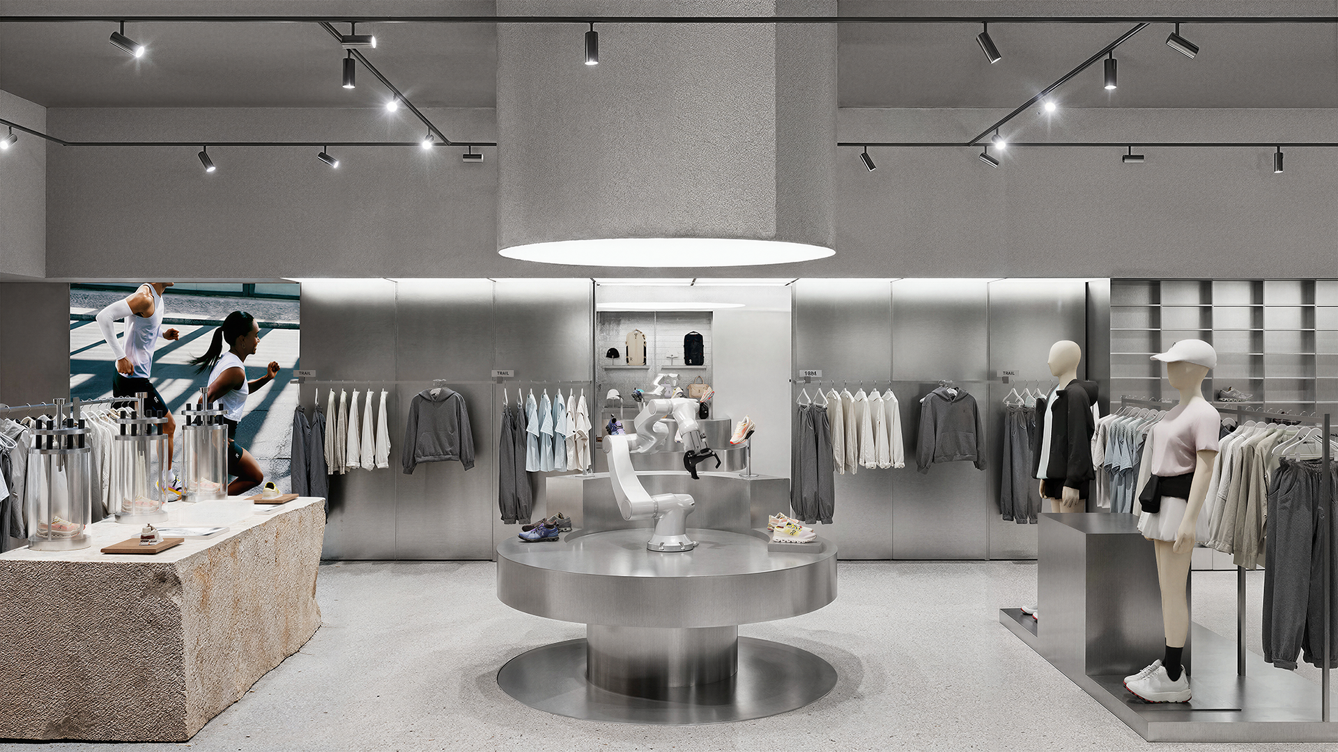 Premium athletic retail display featuring high-performance sportswear on sleek, minimalist mannequins with integrated architectural lighting